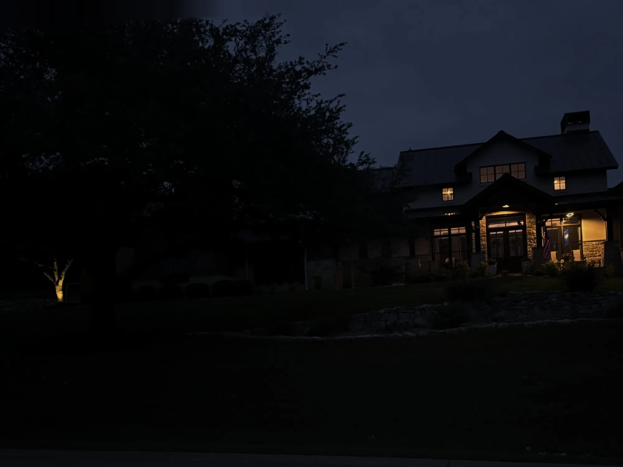 Before: Hill Country home with stone columns and a covered front porch